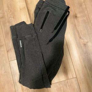Gray Reebok Jogger zipper pockets black drawstring logo on legs